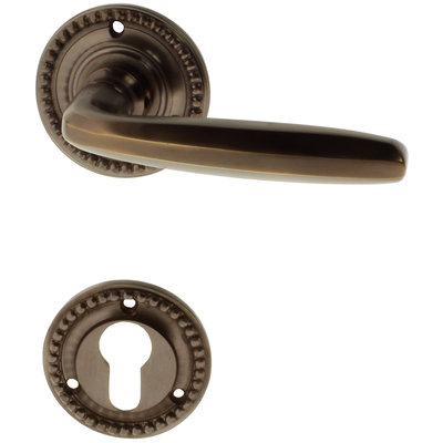 Gründerzeit Wohnungstürbeschlag aus Messing - verziertes Muster - braun